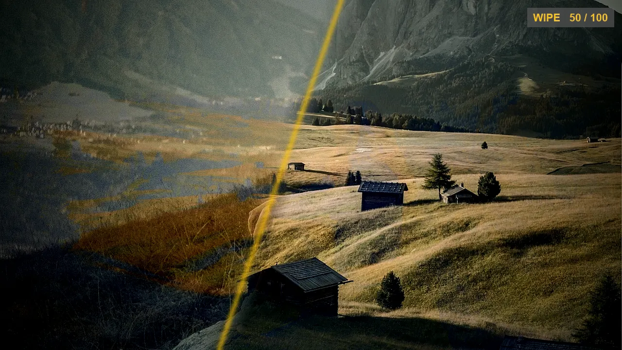 A wipe caught mid-transition between two clips, with a glowing gold edge